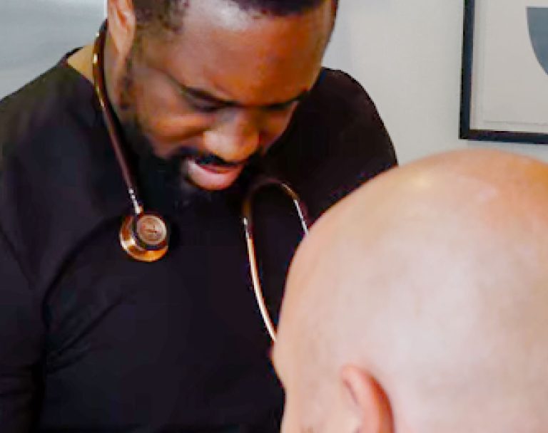 KlutchMD physician listening to a patient during an exam