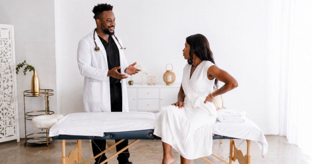 Primary care physician speaking with an adult patient during an office visit regarding a primary care membership in Las Vegas.